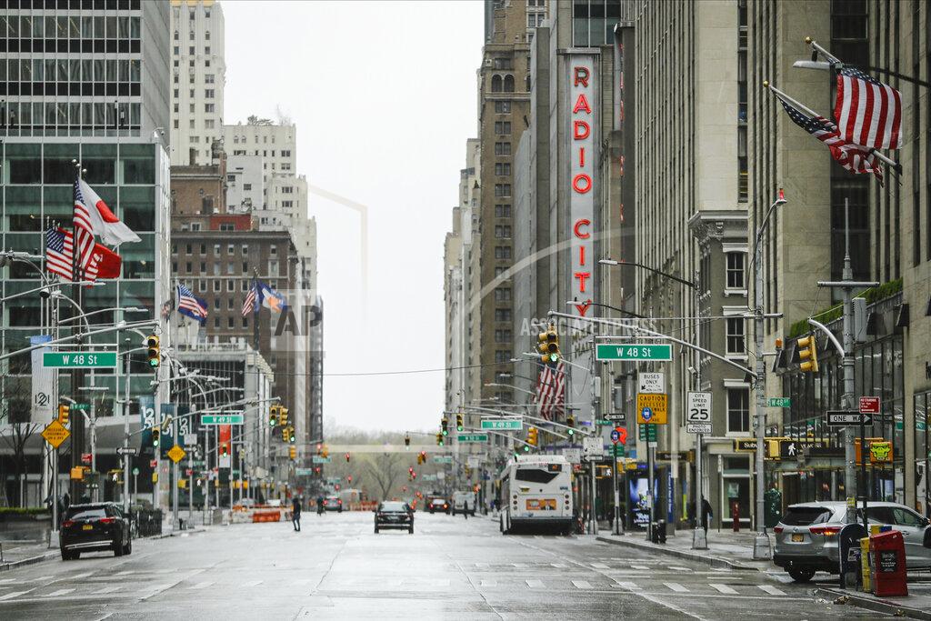 Frank Franklin Ii Pedestrians walk a mostly empty Sixth Avenue during the coronavirus outbreak, Friday, April 3, 2020, in New York. The new coronavirus causes mild or moderate symptoms for most people, but for some, especially older adults and people with existing health problems, it can cause more severe illness or death. (AP Photo/Frank Franklin II)