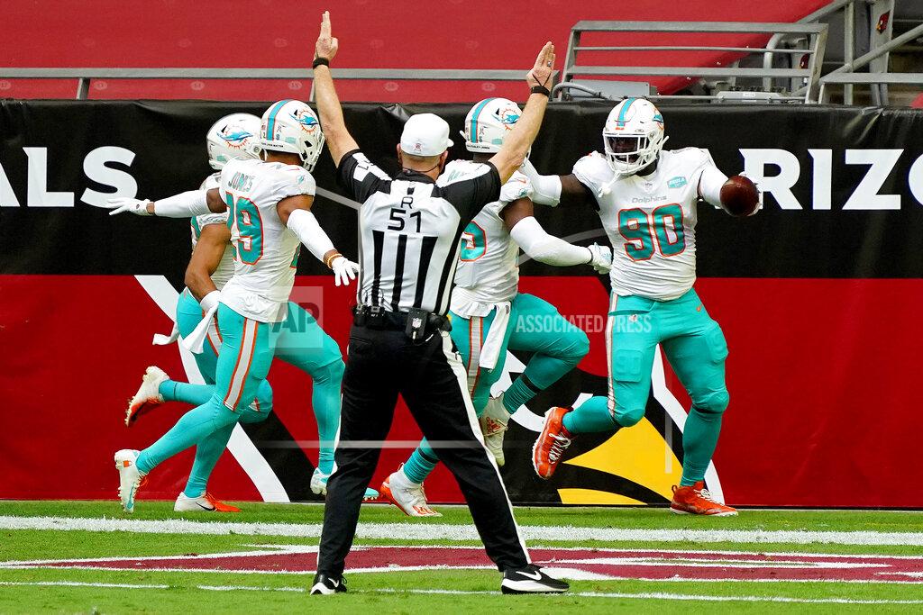 Rick Scuteri Miami Dolphins defensive end Shaq Lawson (90) celebrates his fumble recovery for a touchdown against the Arizona Cardinals during the first half of an NFL football game, Sunday, Nov. 8, 2020, in Glendale, Ariz. (AP Photo/Rick Scuteri)