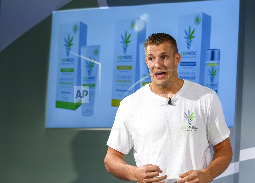 Former New England Patriots tight end Rob Gronkowski holds a news conference announcing his advocacy for CBD and becoming an investor in Abacus Health Products, the maker of CBDMEDIC, Tuesday, Aug. 27, 2019, in New York. (AP Photo/Corey Sipkin)