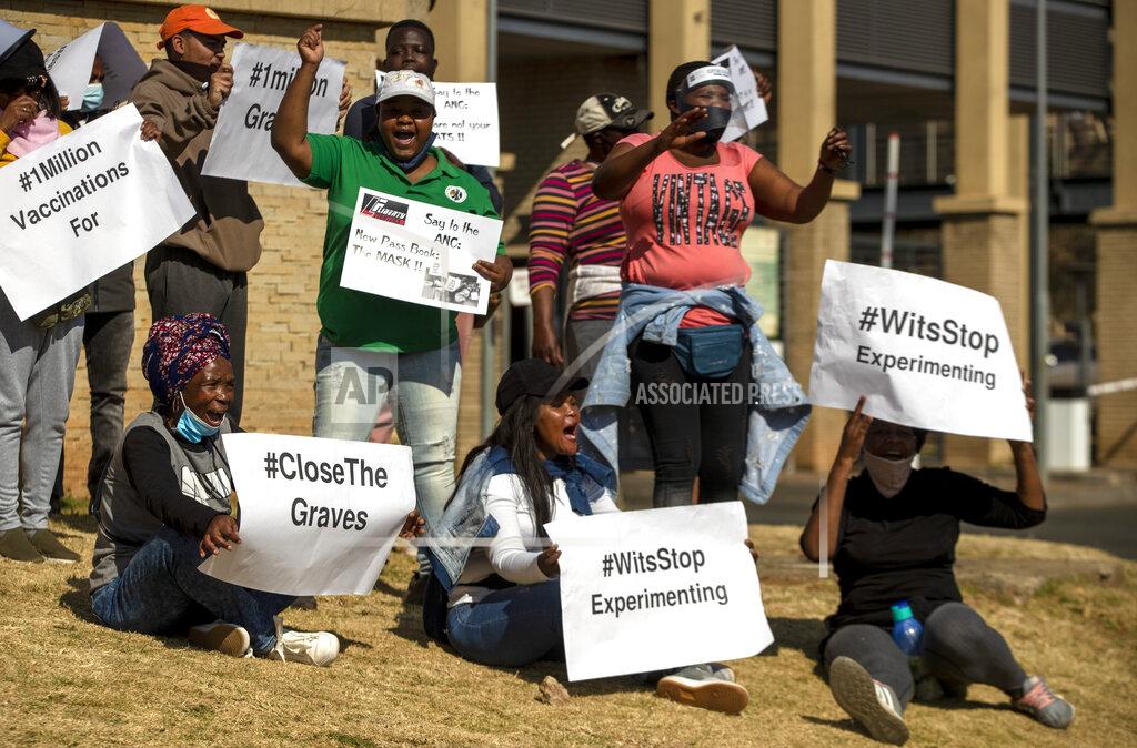 Themba Hadebe People protest against coronavirus trials in Africa, outside Chris Hani Baragwanath Hospita in the township of Soweto in Johannesburg, South Africa, Saturday, July 18, 2020, The first clinical trial in Africa for a COVID-19 vaccine started last week in South Africa. Experts note a worrying level of resistance and misinformation around testing on the continent. (AP Photo/Themba Hadebe)