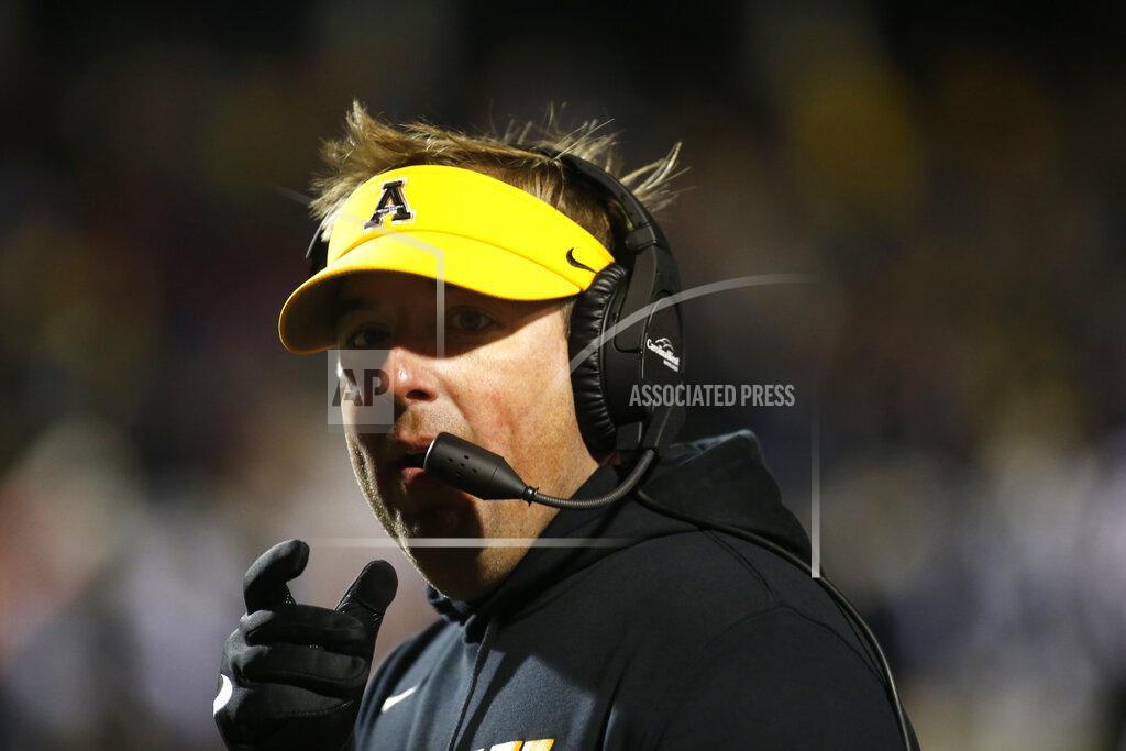 Brian Blanco Appalachian State coach Eliah Drinkwitz walks the sideline during the first half of the team's NCAA college football game against Georgia Southern on Thursday, Oct. 31, 2019, in Boone, N.C. (AP Photo/Brian Blanco)