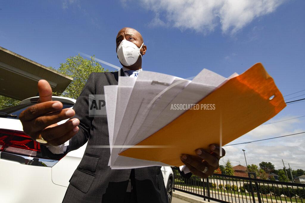 John Amis Tennessee State Rep. Harold Love, Jr. talks to the media as he holds a copy of his family's deed to their former house, Monday, July, 19, 2021, on the north side of Nashville, Tenn. Love Jr.'s father, a Nashville city councilman, was forced to sell his family home here to make way for the highway, but put up a fight in the 1960s against the rerouting of Interstate 40 because he believed it would stifle and isolate Nashville's Black community. Love Jr. is now part of a group pushing to build a cap across the highway that creates a community space to help reunify the city. (AP Photo/John Amis)