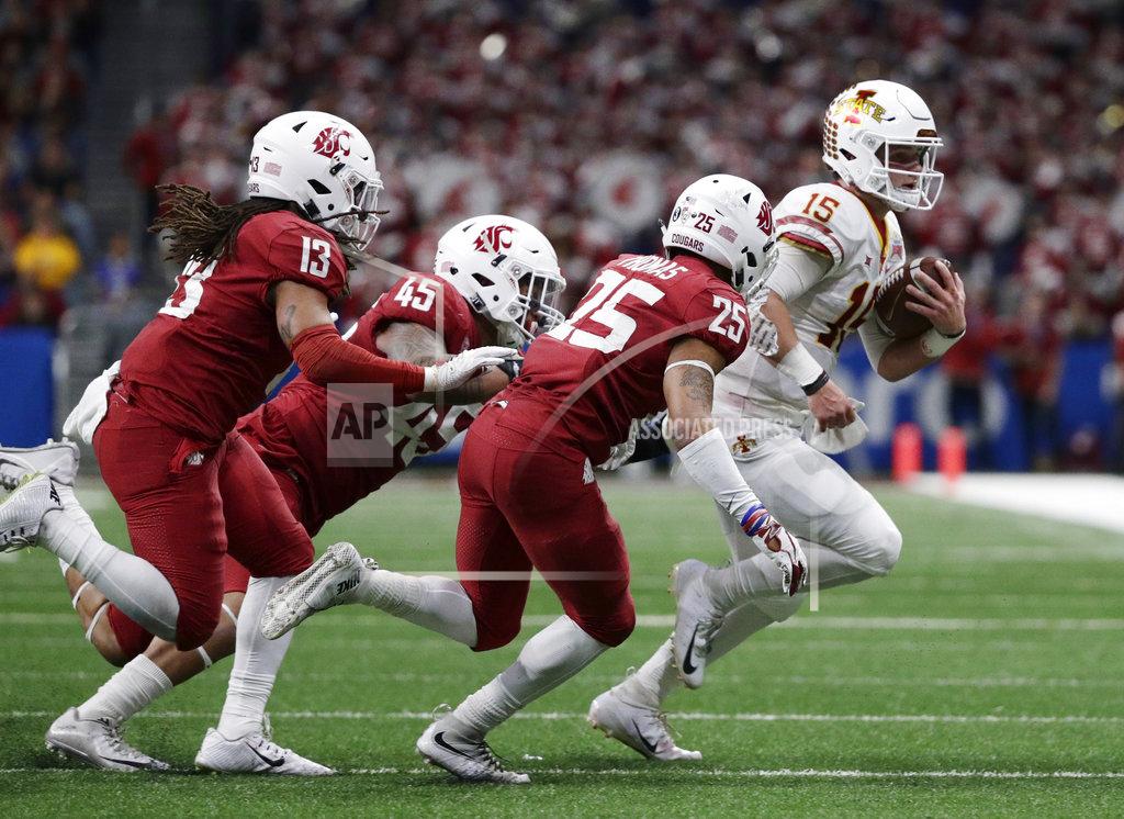 Eric Gay Iowa State quarterback Brock Purdy (15) is stopped short of a first down by Washington State defenders Skyler Thomas (25) and Logan Tago (45) during the second half of the Alamo Bowl NCAA college football game Friday, Dec. 28, 2018, in San Antonio. (AP Photo/Eric Gay)