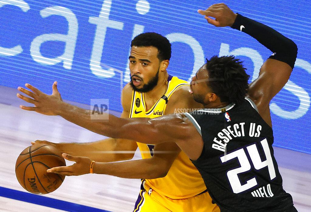 Kevin C. Cox Sacramento Kings' Buddy Hield (24) defends against Los Angeles Lakers' Talen Horton-Tucker (5) during the fourth quarter of an NBA basketball game Thursday, Aug. 13, 2020, in Lake Buena Vista, Fla. (Kevin C. Cox/Pool Photo via AP)