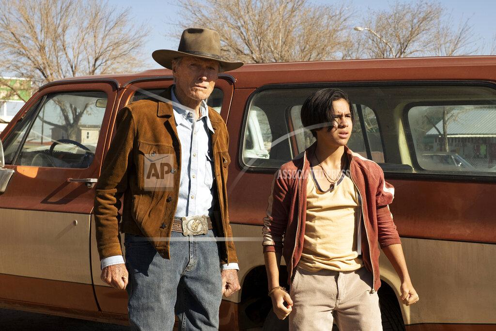 Claire Folger This image released by Warner Bros. Pictures shows Clint Eastwood, left, and Eduardo Minett in a scene from "Cry Macho." (Claire Folger/Warner Bros. Pictures via AP)
