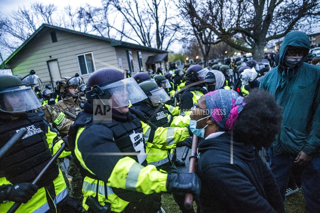Richard Tsong-Taatarii Protesters confronted police over the shooting death of Daunte Wright at a rally at the Brooklyn Center Police Department in Brooklyn Center, Minn., Monday, April 12, 20121. (Richard Tsong-Taatarii/Star Tribune via AP)