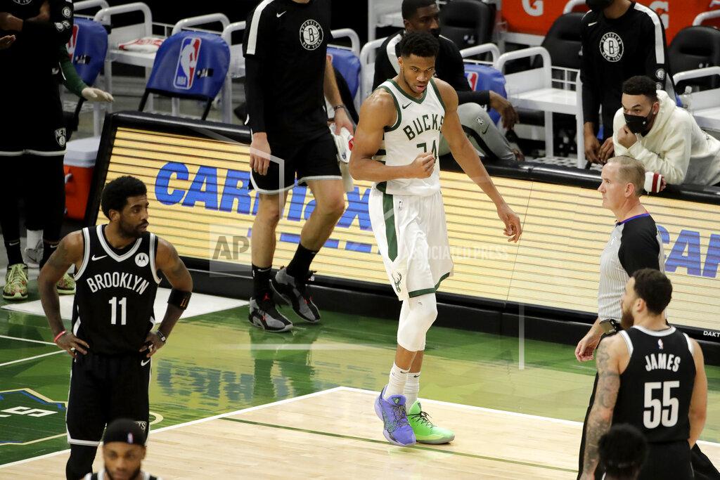 Aaron Gash Milwaukee Bucks' Giannis Antetokounmpo pumps his fist after making a shot during the second half of an NBA basketball game against the Brooklyn Nets Tuesday, May 4, 2021, in Milwaukee. (AP Photo/Aaron Gash)