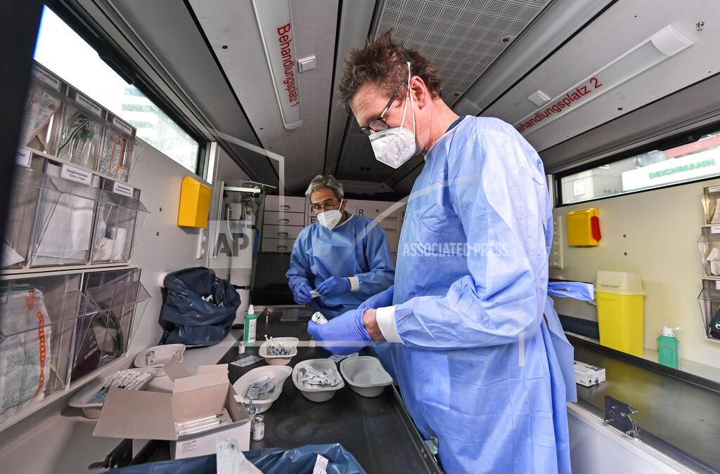 Martin Meissner Medical staff prepares Moderna vaccination in a vaccination mobile on a square at the district Chorweiler in Cologne, Germany, Monday, May 3, 2021. The city of Cologne started a program to bring COVID-19 vaccination to people living in this neighborhood with a high corona incidence. (AP Photo/Martin Meissner)