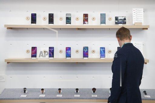 FILE - In this Jan. 8, 2020, file photo, the Google exhibit building shows off a variety of devices with Google Assistant, including Android smartphones and Wear OS smartwatches during the CES tech show in Las Vegas, Nevada, USA. Google is heading to a top European Union court on Monday, Sept. 27, 2021 to appeal a record EU antitrust penalty imposed for stifling competition by abusing the dominance of its Android operating system. (AP Photo/Ross D. Franklin, File)