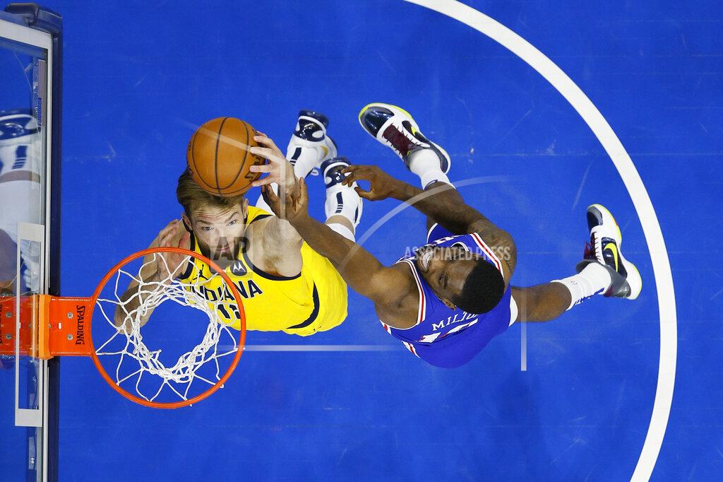 Matt Slocum Indiana Pacers' Domantas Sabonis, left, and Philadelphia 76ers' Shake Milton leap for a rebound during the first half of an NBA basketball game, Monday, March 1, 2021, in Philadelphia. (AP Photo/Matt Slocum)