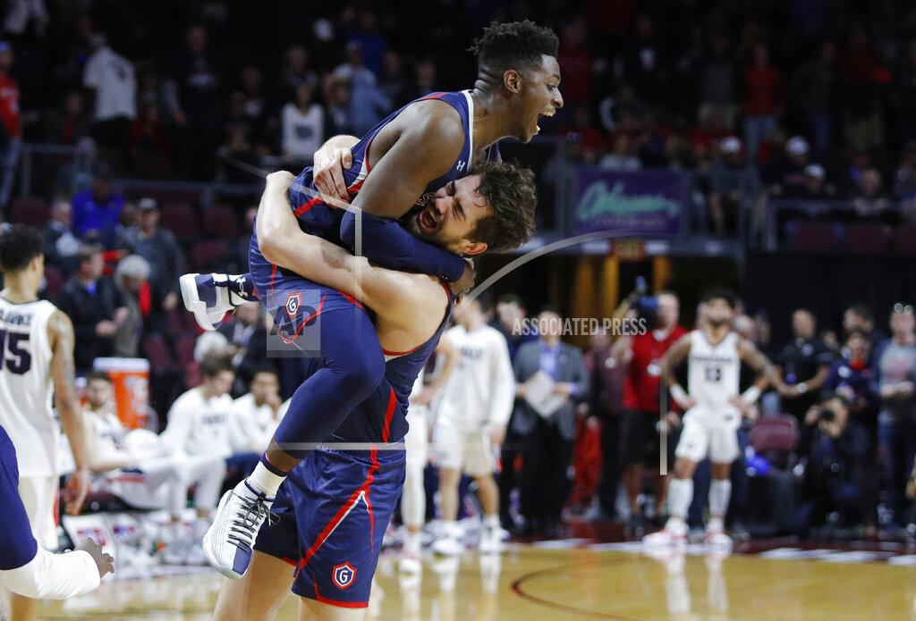 John Locher St. Mary's Jordan Hunter, right, and Malik Fitts celebrate after their team defeated Gonzaga 60-47 in an NCAA college basketball game for the West Coast Conference men's tournament title, Tuesday, March 12, 2019, in Las Vegas. (AP Photo/John Locher)