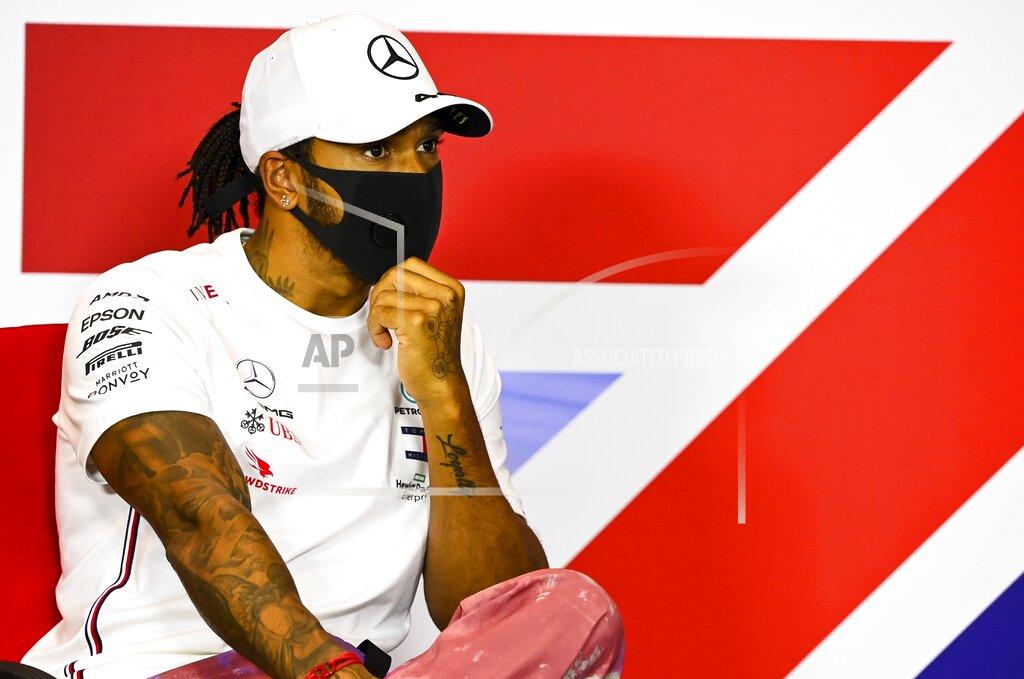 Mark Sutton Mercedes driver Lewis Hamilton of Britain attends the press conference in the build-up to the 70th Anniversary Formula One Grand Prix at the Silverstone circuit, Silverstone, England, Thursday, Aug. 6, 2020. (Mark Sutton/Pool via AP)