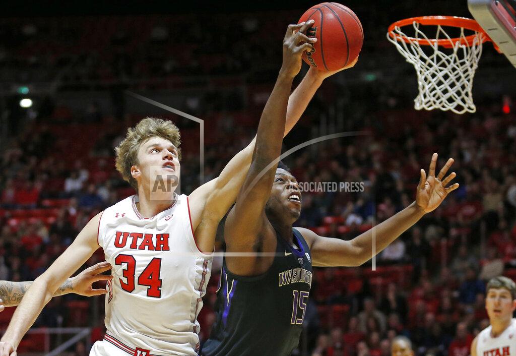 Rick Bowmer Washington forward Noah Dickerson (15) and Utah center Jayce Johnson (34) battle for a rebound during the first half of an NCAA college basketball game Thursday, Jan., 10, 2019, in Salt Lake City. (AP Photo/Rick Bowmer)