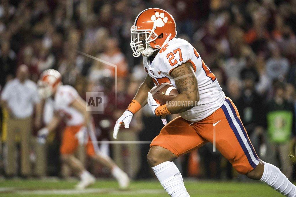 Sean Rayford Clemson running back C.J. Fuller (27) runs with the ball against South Carolina during the first half of an NCAA college football game Saturday, Nov. 25, 2017, in Columbia, S.C. (AP Photo/Sean Rayford)