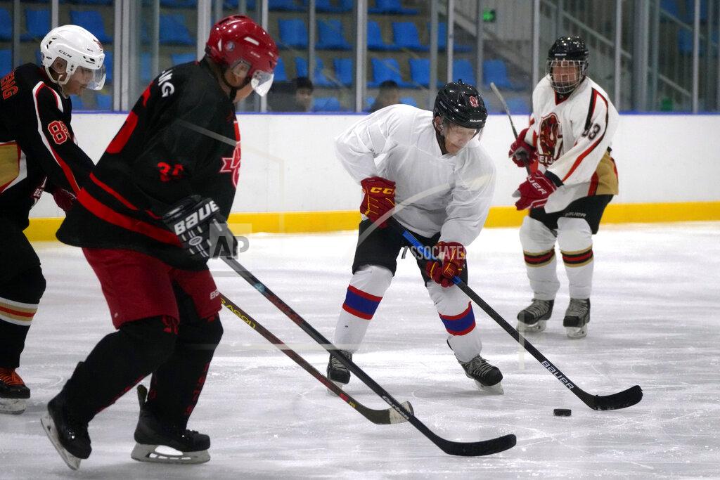 Mark Schiefelbein Members of the "1979" hockey club compete during a hockey match at a rink in Beijing, Wednesday, Jan. 12, 2022. Spurred by enthusiasm after China was awarded the 2022 Winter Olympics, the members of a 1970s-era youth hockey team, now around 60 years old, have reunited decades later to once again take to the ice. (AP Photo/Mark Schiefelbein)