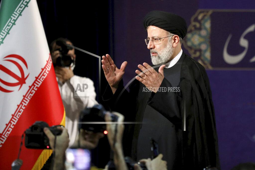 Ebrahim Noroozi Ebrahim Raisi, head of Iran's judiciary leaves a news conference after registering his candidacy for the June 18 presidential elections at the elections headquarters of the Interior Ministry in Tehran, Iran, Saturday, May 15, 2021. (AP Photo/Ebrahim Noroozi)