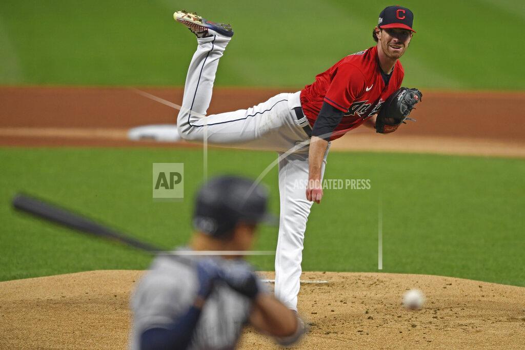 David Dermer Cleveland Indians starting pitcher Shane Bieber (57) delivers to New York Yankees' Giancarlo Stanton (27) in the first inning of Game 1 of an American League wild-card baseball series, Tuesday, Sept. 29, 2020, in Cleveland. (AP Photo/David Dermer)