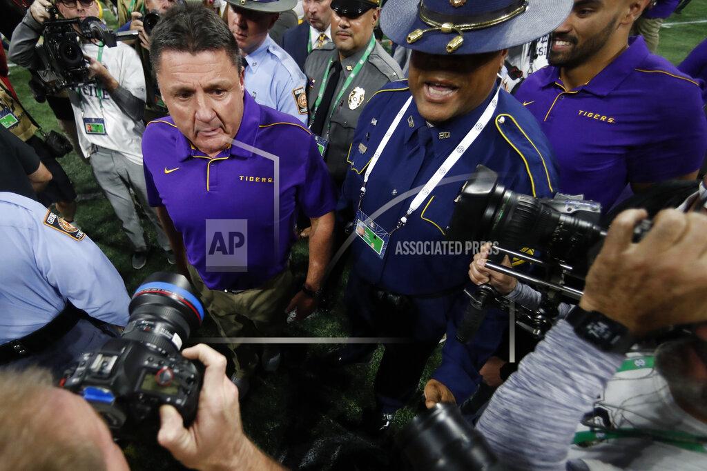 John Bazemore LSU head coach Ed Orgeron leaves the field after the Southeastern Conference championship NCAA college football game against Georgia, Saturday, Dec. 7, 2019, in Atlanta. LSU won 37-10. (AP Photo/John Bazemore)