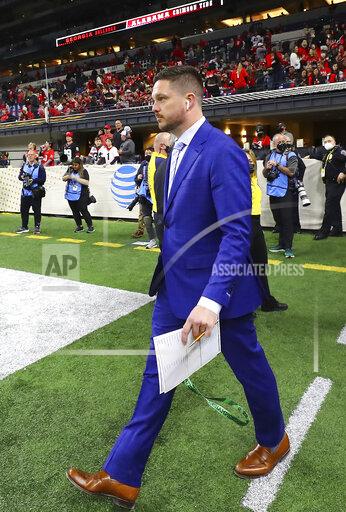 Georgia assistant coach Dan Lanning takes the field to help coach the team in his final game after taking the head coaching job at the University of Oregon, at the College Football Playoff championship game Monday, Jan. 10, 2022, in Indianapolis. (Curtis Compton/Atlanta Journal-Constitution via AP)