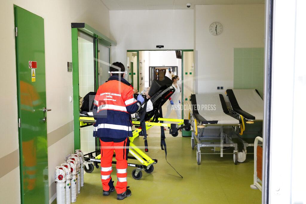 Petr David Josek Medical workers attend to a covid-19 patient at a hospital overrun by the covid pandemic in Cheb, Czech Republic, Friday, Feb. 12, 2021. The Czech government has imposed a complete lockdown of the three hardest-hit counties to help contain the spread of a highly contagious variant of the coronavirus. The meeasures will became effective Friday for the two counties in western Czech Republic on the German border Cheb and Sokolov and another county in the northern part of the country Trutnov located on the border with Poland. (AP Photo/Petr David Josek)