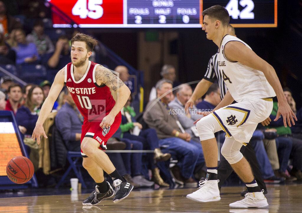 Robert Franklin North Carolina State's Braxton Beverly (10) drives downcourt next to Notre Dame's Nate Laszewski during the second half of an NCAA college basketball game Saturday, Jan. 19, 2019, in South Bend, Ind. North Carolina State won 77-73. (AP Photo/Robert Franklin)