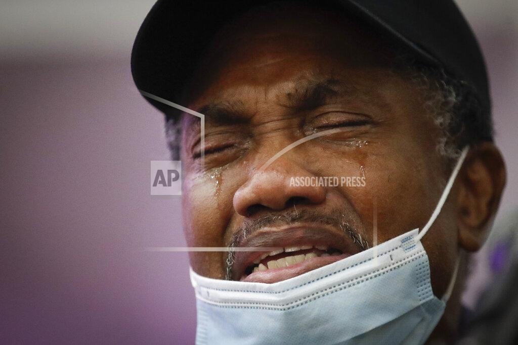 Marcio Jose Sanchez FILE - In this July 21, 2020, file photo, Samuel Nunez cries as he eulogizes his daughter Lydia Nunez, who died from COVID-19, during a funeral service in memory of her at the Metropolitan Baptist Church in Los Angeles. The U.S. death toll from COVID-19 has almost topped 500,000 — a number so staggering that a top health researchers says it is hard to imagine an American who hasn't lost a relative or doesn't know someone who died. (AP Photo/Marcio Jose Sanchez, File)