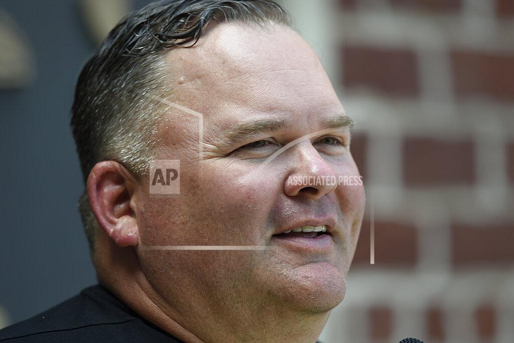 Gail Burton FILE - In this June 12, 2019, file photo, Baltimore Ravens offensive coordinator Greg Roman speaks with reporters at the NFL football team's training facility in Owings Mills, Md. The success of the Ravens has created an interest in coordinators Greg Roman and Don Martindale as potential candidates to fill NFL head coaching vacancies. (AP Photo/Gail Burton, File)