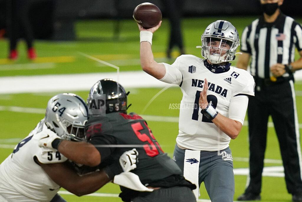 John Locher Nevada quarterback Carson Strong (12) throws against UNLV during the first half of an NCAA college football game Saturday, Oct. 31, 2020, in Las Vegas. (AP Photo/John Locher)