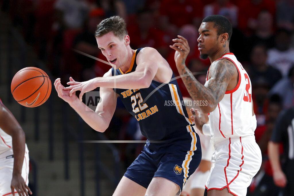 Michael Wyke Northern Colorado forward Riley Abercrombie (22) loses the ball under pressure from Houston forward Reggie Chaney (32) during the second half of an NCAA college basketball game Monday, Nov. 7, 2022, in Houston. (AP Photo/Michael Wyke)