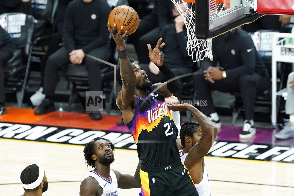 Matt York Phoenix Suns center Deandre Ayton, middle, shoots against the Los Angeles Clippers during the first half of Game 2 of the NBA basketball Western Conference Finals, Tuesday, June 22, 2021, in Phoenix. (AP Photo/Matt York)