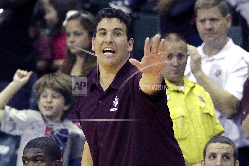John Raoux FILE - In this Nov. 28, 2010, file photo, then Texas A&M assistant coach Scott Spinelli calls to players during an NCAA college basketball game against Temple in Lake Buena Vista, Fla. Spinelli will take over as Boston College's interim men's basketball head coach against Notre Dame on Saturday Feb. 27, 2021. (AP Photo/John Raoux)