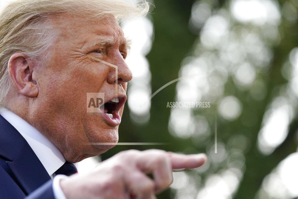 Alex Brandon President Donald Trump speaks with reporters as he walks to Marine One on the South Lawn of the White House, Tuesday, Sept. 15, 2020, in Washington. Trump is en route to Philadelphia. (AP Photo/Alex Brandon)