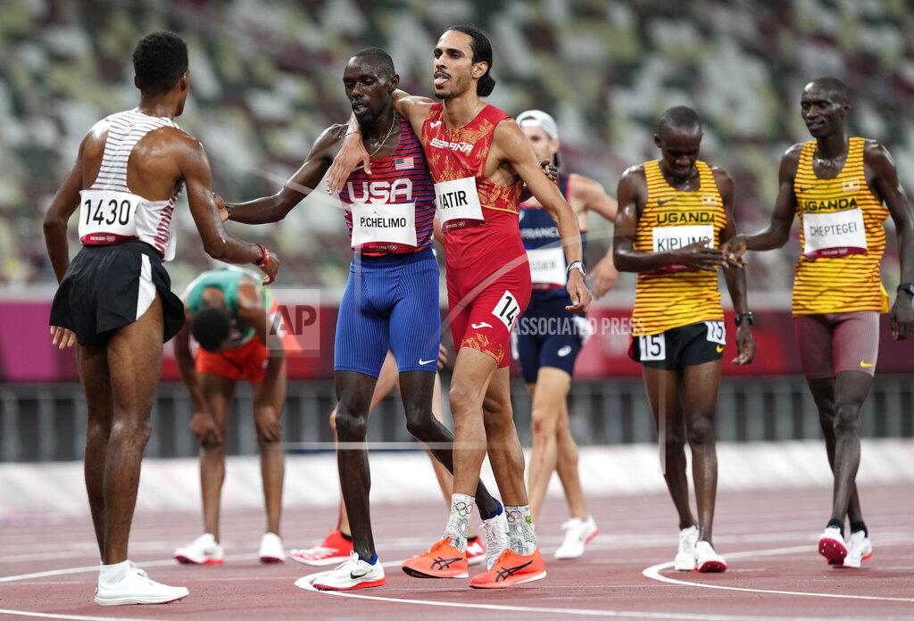 Martin Meissner Mohamed Katir, of Spain and Paul Chelimo, of United States embrace as they finish in a men's 5,000-meter heat at the 2020 Summer Olympics, Tuesday, Aug. 3, 2021, in Tokyo, Japan. (AP Photo/Martin Meissner)