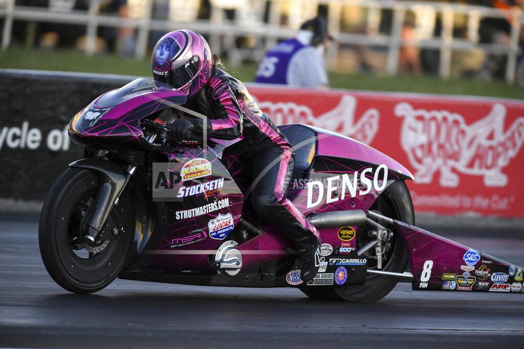 Jerry Foss CORRECTS TO BROWNSBURG NOT INDIANAPOLIS - In this photo provided by the NHRA, Angie Smith powers to the provisional No. 1 spot on her Pro Stock Motorcycle to kick off the NHRA U.S. Nationals in Brownsburg, Ind., Friday, Sept. 4, 2020. ( Jerry Foss/NHRA via AP)
