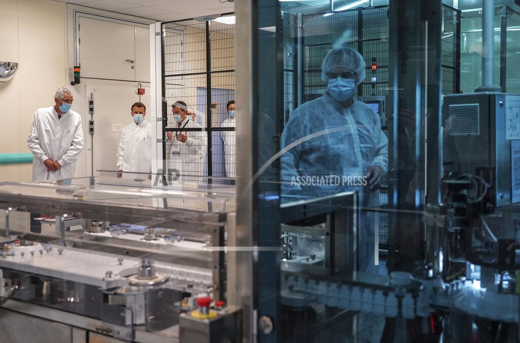 Laurent Cipriani FILE - In this June 16, 2020, file photo, French President Emmanuel Macron listens to a researcher as he visits an industrial development laboratory at French drugmaker's vaccine unit Sanofi Pasteur plant in Marcy-l'Etoile, near Lyon, central France. As the race for a vaccine against the new coronavirus intensifies, many rich countries are rushing to the front of the line by placing advance orders for the inevitably limited supply to guarantee their citizens are immunized first. (AP Photo/Laurent Cipriani, Pool)