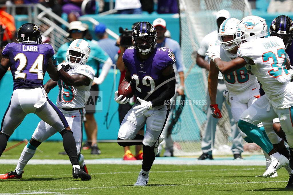 Brynn Anderson Baltimore Ravens free safety Earl Thomas (29) runs after intercepting a pass by Miami Dolphins quarterback Ryan Fitzpatrick , during the first half at an NFL football game, Sunday, Sept. 8, 2019, in Miami Gardens, Fla. (AP Photo/Brynn Anderson)