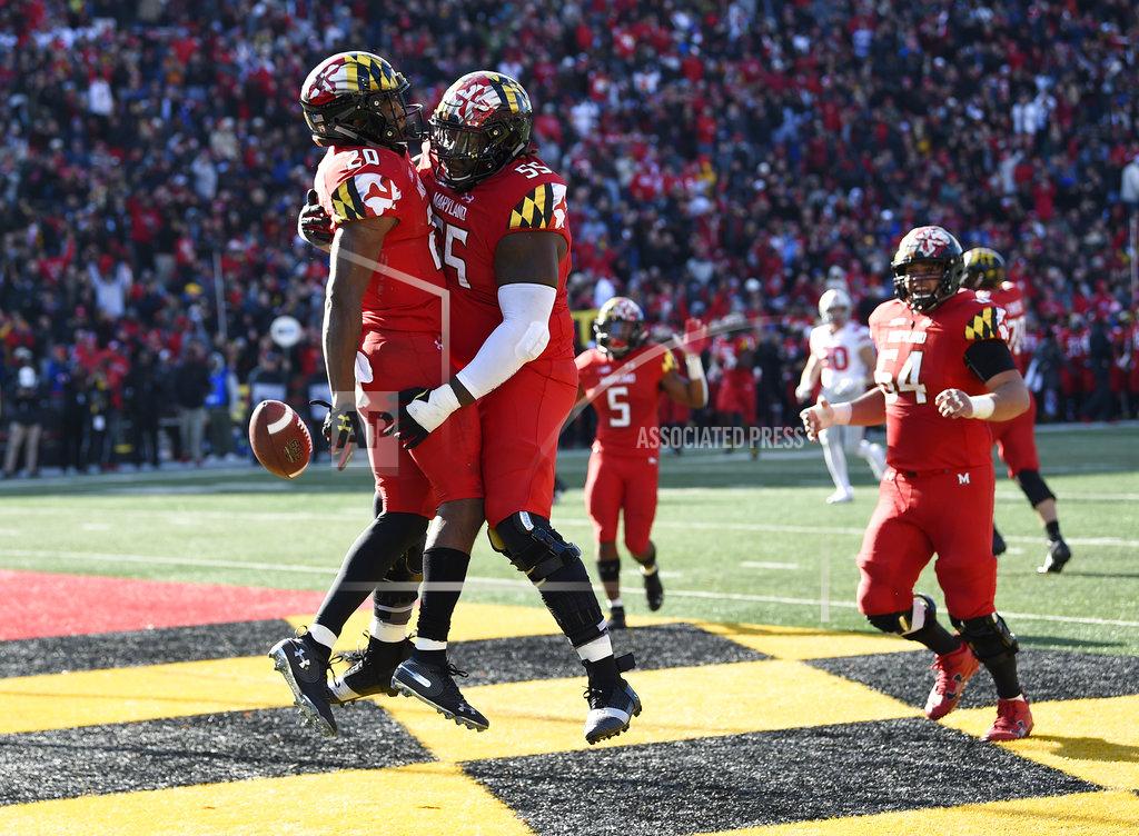 Nick Wass Maryland running back Javon Leake (20) celebrates his touchdown with offensive lineman Derwin Gray (55) and offensive lineman Spencer Anderson (54) during the first half of an NCAA football game against Ohio State, Saturday, Nov. 17, 2018, in College Park, Md. (AP Photo/Nick Wass)