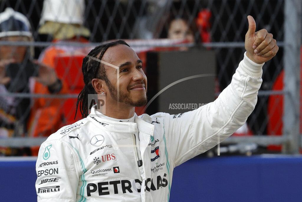 Luca Bruno Mercedes driver Lewis Hamilton of Britain celebrates after setting the second fastest time at the end of the qualifying session practice at the 'Sochi Autodrom' Formula One circuit, in Sochi, Russia, Saturday, Sept. 28, 2019. The Formula one race will be held on Sunday. (AP Photo/Luca Bruno)