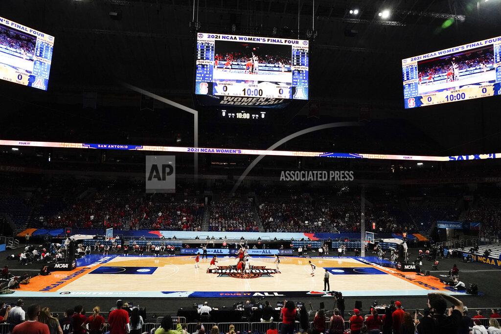 Morry Gash FILE - Players get set for the opening tipoff of the championship game between Stanford and Arizona in the women's Final Four NCAA college basketball tournament in San Antonio, April 4, 2021. A year after the NCAA got called out for gender inequities between its men’s and women’s basketball tournaments, the organization has made changes over the past six months to make it more equitable. (AP Photo/Morry Gash, File)