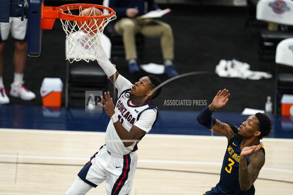 Darron Cummings Gonzaga's Joel Ayayi (11) shoots in front of West Virginia's Gabe Osabuohien during the second half of an NCAA college basketball game Wednesday, Dec. 2, 2020, in Indianapolis. (AP Photo/Darron Cummings)