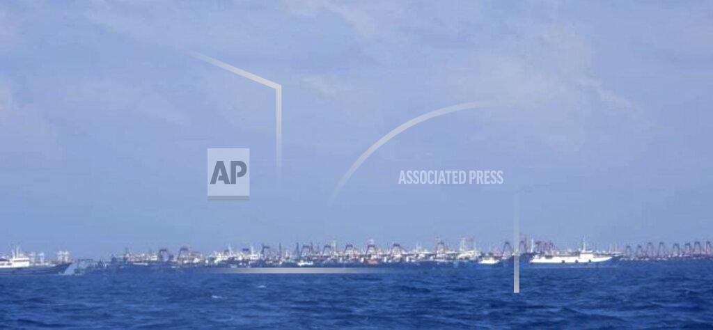 Uncredited In this photo provided on Sunday, March 21, by the Philippine Coast Guard/National Task Force-West Philippine Sea, some of the 220 Chinese vessels are seen moored at Whitsun Reef, South China Sea on March 7, 2021. The Philippine government expressed concern after spotting more than 200 Chinese fishing vessels it believed were crewed by militias at a reef claimed by both countries in the South China Sea, but it did not immediately lodge a protest. (Philippine Coast Guard/National Task Force-West Philippine Sea via AP)