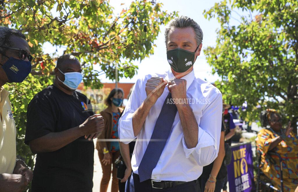 Shae Hammond California Gov. Gavin Newsom is greeted by supporters at a rally at St. Mary's Center in Oakland, Calif., Saturday, Sept. 11, 2021. The last day to vote in the recall election is Tuesday, Sept. 14. A majority of voters must mark "no" on the recall to keep Newsom in office. (Shae Hammond/Bay Area News Group via AP)