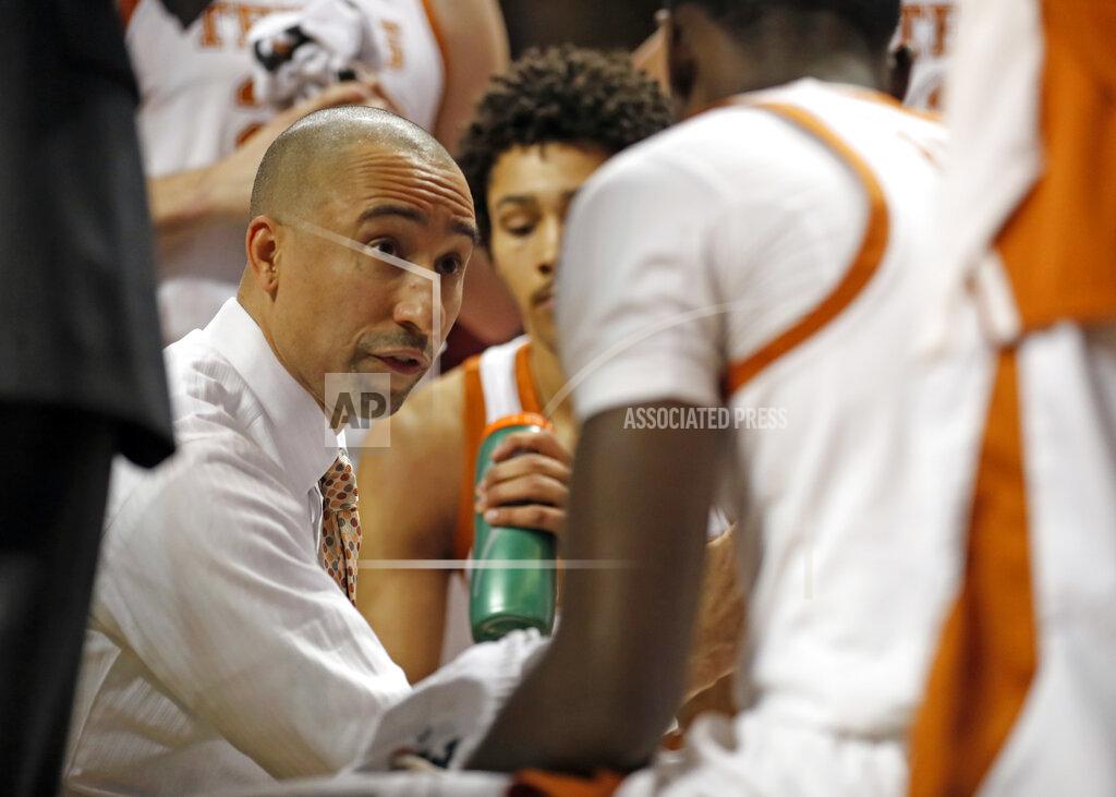 Brad Tollefson FILE - In this March 4, 2019, file photo, Texas coach Shaka Smart talks to his players on the bench during the first half of an NCAA college basketball game against Texas Tech in Lubbock, Texas. Smart’s four seasons with the Longhorns have produced a national tournament championship and three one-and-done first-round NBA draft picks. (AP Photo/Brad Tollefson, File)