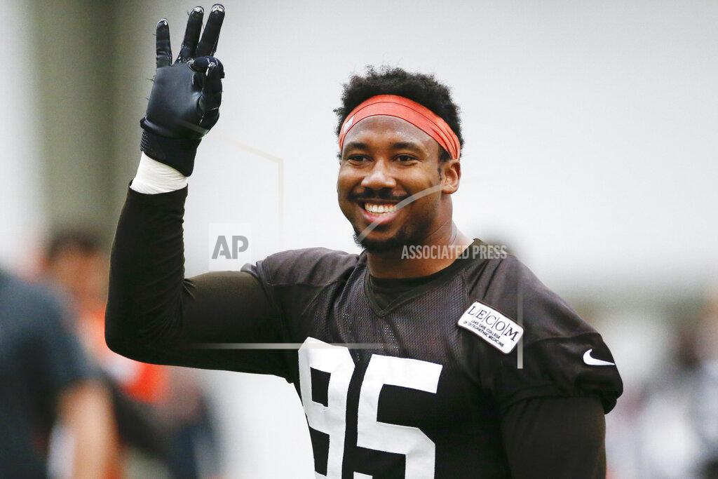 Ron Schwane FILE - In this June 6, 2019, file photo, Cleveland Browns defensive end Myles Garrett reacts after a play during practice at the team's NFL football training facility in Berea, Ohio. The Cleveland Browns are closing in on a massive contract extension with Garrett, a person familiar with the negotiations told the Associated Press on Tuesday, July 14, 2020. Garrett, the No. 1 overall pick in 2017 and one of the NFL's premiere edge rushers, and the team could have the deal completed in the next day or so, said the person who spoke on condition of anonymity because of the sensitivity of the talks. (AP Photo/Ron Schwane, File)