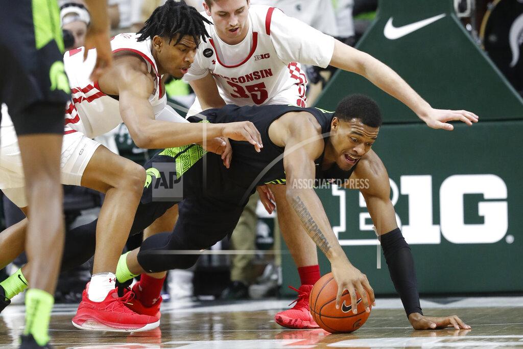 Carlos Osorio Wisconsin forward Aleem Ford, left, and Michigan State forward Xavier Tillman chase the ball during the first half of an NCAA college basketball game, Friday, Jan. 17, 2020, in East Lansing, Mich. (AP Photo/Carlos Osorio)