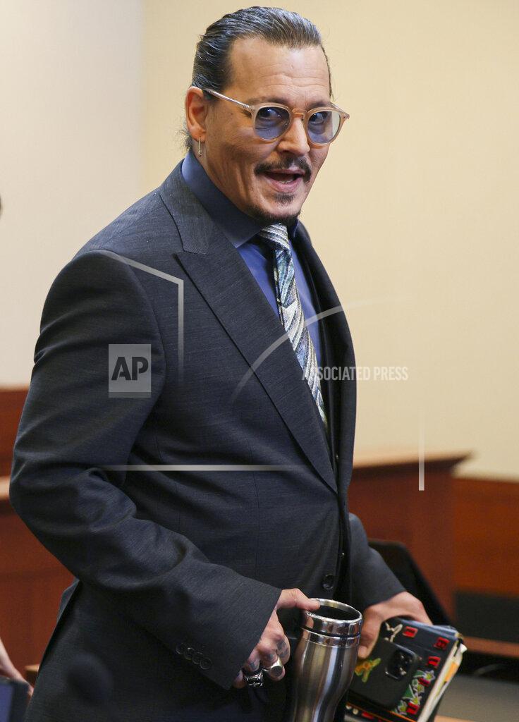 Evelyn Hockstein Actor Johnny Depp arrives at the Fairfax County Circuit Courthouse in Fairfax, Va., Wednesday, May 25, 2022. Depp sued his ex-wife Amber Heard for libel in Fairfax County Circuit Court after she wrote an op-ed piece in The Washington Post in 2018 referring to herself as a "public figure representing domestic abuse." (Evelyn Hockstein/Pool photo via AP)