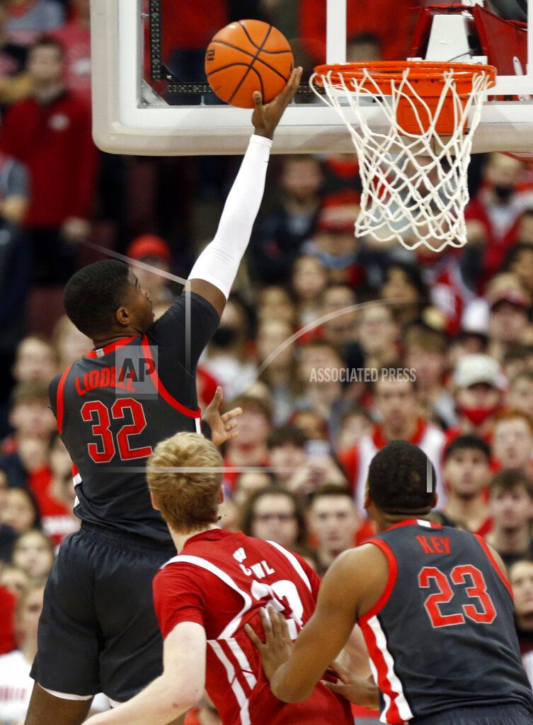 Paul Vernon Ohio State forward E.J. Liddell, left, goes up for a shot in front of Wisconsin forward Steven Crowl, center, and Ohio State forward Zed Key during the first half of an NCAA college basketball game in Columbus, Ohio, Saturday, Dec. 11, 2021. (AP Photo/Paul Vernon)