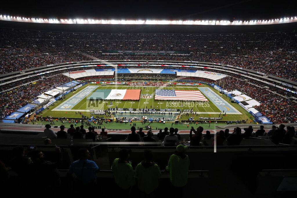 Eduardo Verdugo The flags of Mexico and the United States cover the field before an NFL football game between the Los Angeles Chargers and the Kansas City Chiefs Monday, Nov. 18, 2019, in Mexico City. (AP Photo/Eduardo Verdugo)