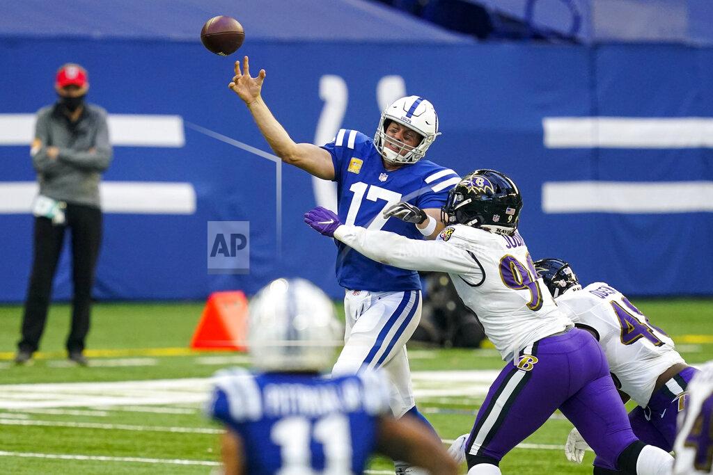 Darron Cummings Indianapolis Colts quarterback Philip Rivers (17) is pressured by Baltimore Ravens outside linebacker Matt Judon (99) in the second half of an NFL football game in Indianapolis, Sunday, Nov. 8, 2020. (AP Photo/Darron Cummings)