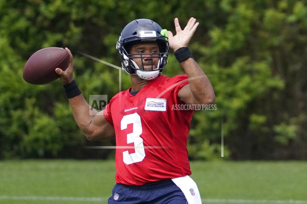 Ted S. Warren Seattle Seahawks quarterback Russell Wilson passes during NFL football practice Tuesday, June 8, 2021, in Renton, Wash. (AP Photo/Ted S. Warren)